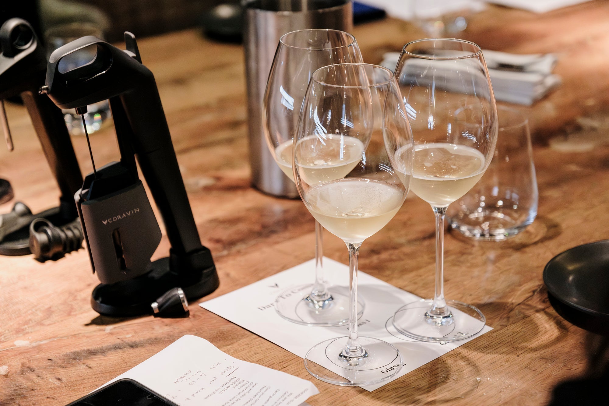 3 glasses of white with on paper, with Coravin Timeless wine preservation system